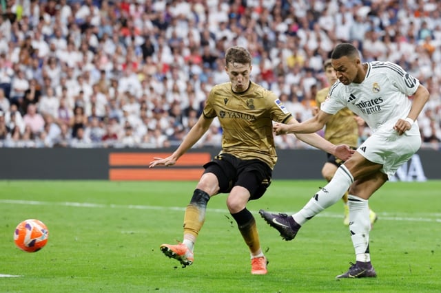 Golden finish: Kylian Mbappe scoring his second goal, and his last of the league season, as  Real Madrid beat Real Sociedad