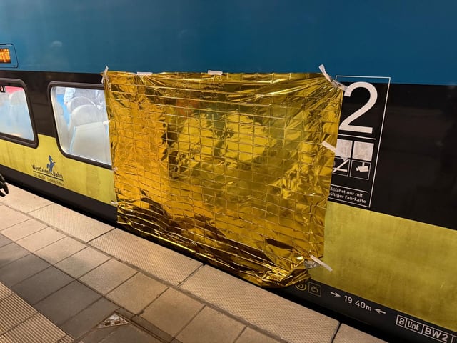 A rescue blanket was used to shield the trapped passenger from view.