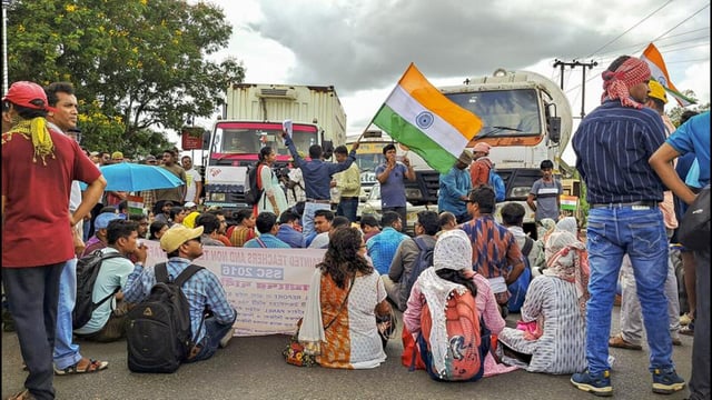 Teachers and non-teaching staff of the West Bengal government who have been rendered jobless protest in Kharagpur. (PTI Photo)