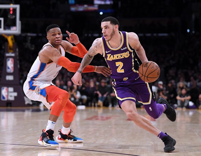 LOS ANGELES, CALIFORNIA - JANUARY 02: Lonzo Ball #2 of the Los Angeles Lakers drives past Russell Westbrook #0 of the Oklahoma City Thunder during a 107-100 Thunder win at Staples Center on January 02, 2019 in Los Angeles, California.