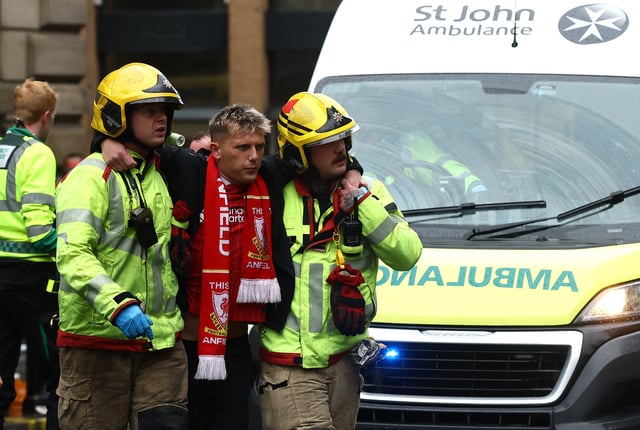 Emergency services help an injured fan. The number of casualties is not known
