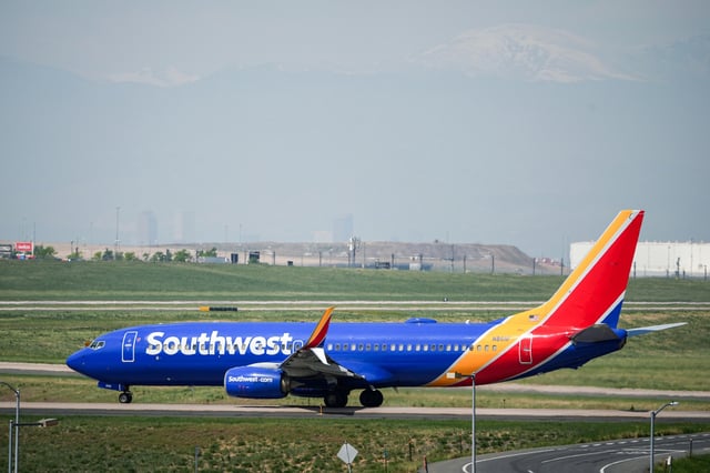A Southwest Airlines jetliner taxis down a runway for departure from Denver International Airport in Denver, Colo., on May 23, 2025.