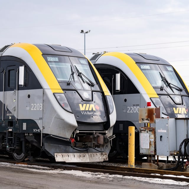 New passenger trains sit on the tracks at the Via Rail Canada Maintenance Centre in Montreal, Thursday, Feb. 22, 2024. THE CANADIAN PRESS/Christinne Muschi