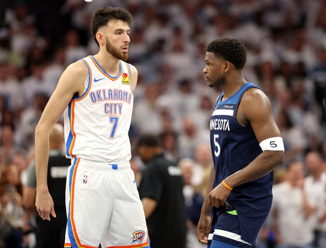 MINNEAPOLIS, MINNESOTA - MAY 24: Chet Holmgren #7 of the Oklahoma City Thunder and Anthony Edwards #5 of the Minnesota Timberwolves look on prior to Game Three of the Western Conference Finals of the 2025 NBA Playoffs at Target Center on May 24, 2025 in Minneapolis, Minnesota.