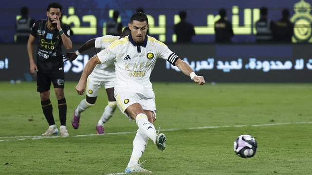 Al Nassr's Cristiano Ronaldo scores their second goal from the penalty spot.