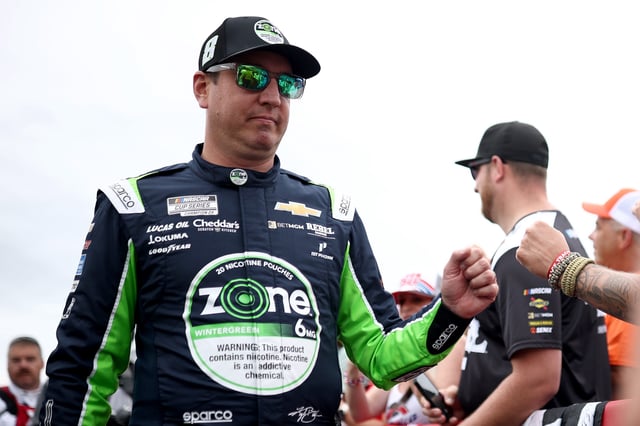 Kyle Busch, driver of the #8 zone Chevrolet, greets fans as he walks the grid prior to the NASCAR Cup Series Coca-Cola 600 at Charlotte Motor Speedway on May 25, 2025 in Concord, North Carolina.