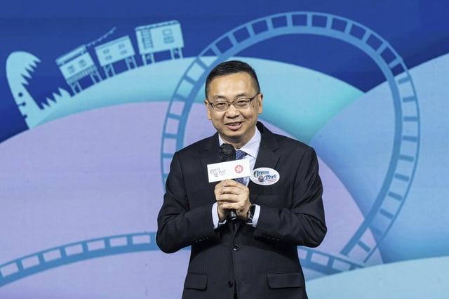 Benson Kwok, director of Immigration, speaks during the naming ceremony of the Hong Kong-born giant panda twin cubs Jia Jia and De De in Hong Kong, Tuesday, May 27, 2025. (AP Photo/Chan Long Hei)