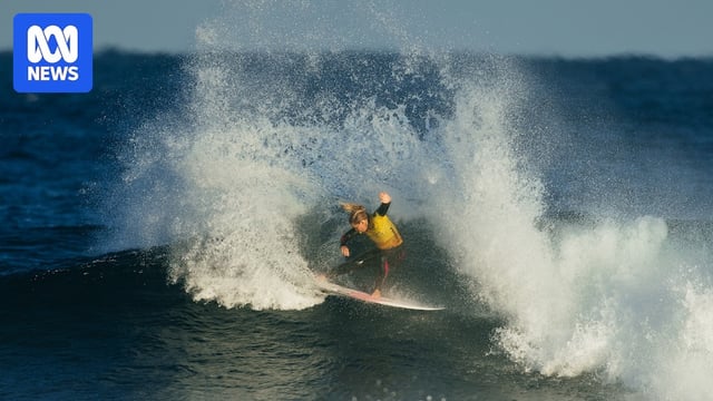 Gabriela Bryan cutting back on wave flicking spray high into air