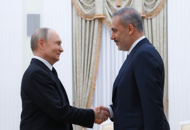 Russian President Vladimir Putin and Turkish Foreign Minister Hakan Fidan shake hands before a meeting at the Kremlin in Moscow, Russia May 26, 2025. Sputnik/Alexey Maishev/Pool via REUTERS ATTENTION EDITORS - THIS IMAGE WAS PROVIDED BY A THIRD PARTY.