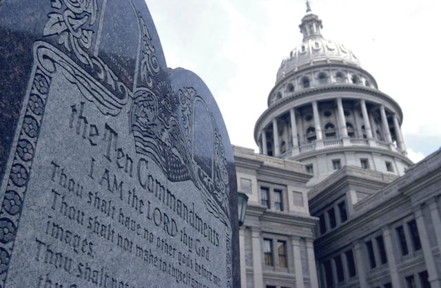 FILE - This 5-foot tall stone slab bearing the Ten Commandments stands near the Capitol in Austin, Texas, in this July 29, 2002 file photo.  (AP Photo/Harry Cabluck, File)