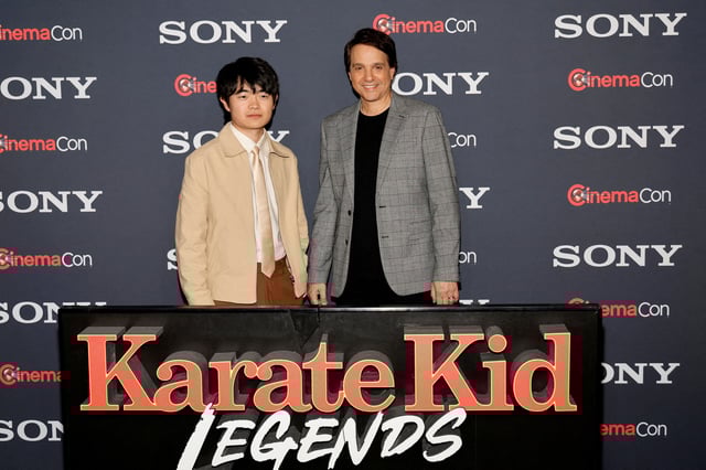 Ben Wang and Ralph Macchio, pose as they promote the upcoming movie "Karate Kid: Legends," before a Sony Pictures presentation at CinemaCon, the official convention of Cinema United, in Las Vegas, Nevada, U.S. March 31, 2025. REUTERS/Steve Marcus/File Photo