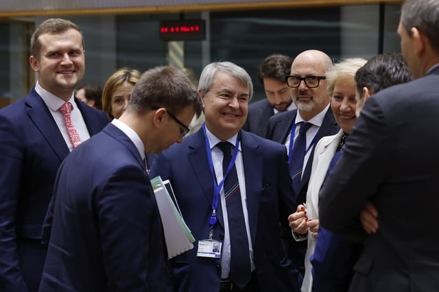 Hungarian Minister for European Union Affairs Janos Boka, front left, speaks with Italy's Permanent Representative to the EU Vincenzo Celeste, center, during a meeting of the general affairs ministers at the European Council building in Brussels, Tuesday, May 27, 2025. (AP Photo/Omar Havana)