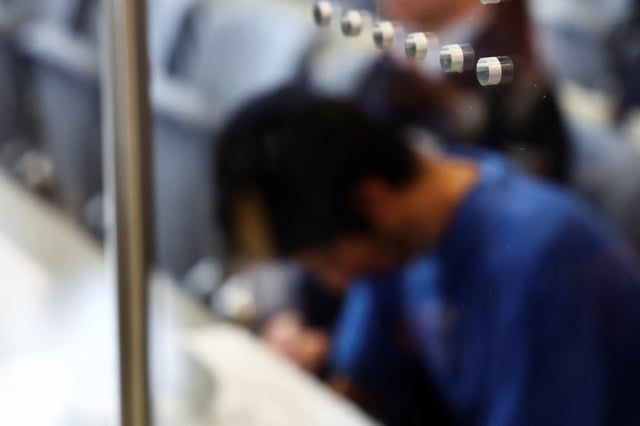 Issa al H., a Syrian national suspected of stabbing to death three people at a festival in the German city of Solingen in 2024, sits at the beginning of his trial in Duesseldorf, Germany, May 27, 2025. REUTERS/Leon Kuegeler