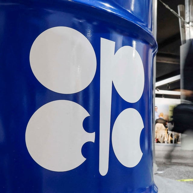 FILE PHOTO: People walk past an installation depicting barrel of oil with the logo of Organization of the Petroleum Exporting Countries (OPEC) during the COP29 United Nations climate change conference in Baku, Azerbaijan November 19, 2024. REUTERS/Maxim Shemetov/File Photo