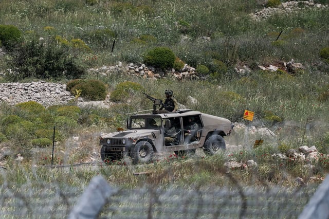 An Israeli military vehicle is seen near the border between the Israeli-occupied Golan Heights and Syria, May 4, 2025. REUTERS/Shir Torem/File Photo