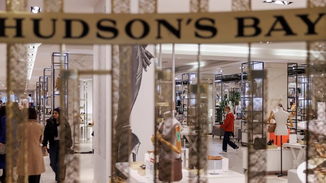 Shoppers are pictured in Hudson’s Bay department store, in Toronto, on March 13. Hudson's Bay will lay off more than 8,300 employees by June 1, according to documents published Monday evening, at which point the retailer will have closed all its stores and its liquidation sale will have run its course.