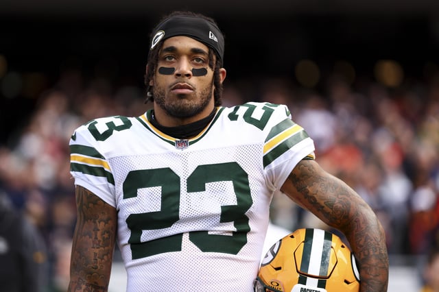Jaire Alexander #23 of the Green Bay Packers stands on the sidelines during the national anthem prior to an NFL football game against the Chicago Bears at Soldier Field on November 17, 2024 in Chicago, Illinois.