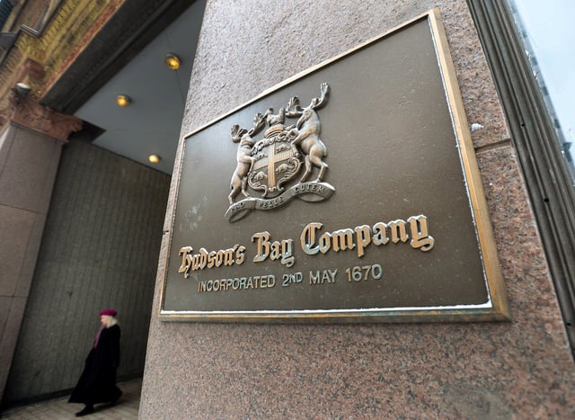 A women leaves the downtown Toronto flagship Hudson Bay Company store in Toronto on Monday, January 27, 2014. THE CANADIAN PRESS/Nathan Denette