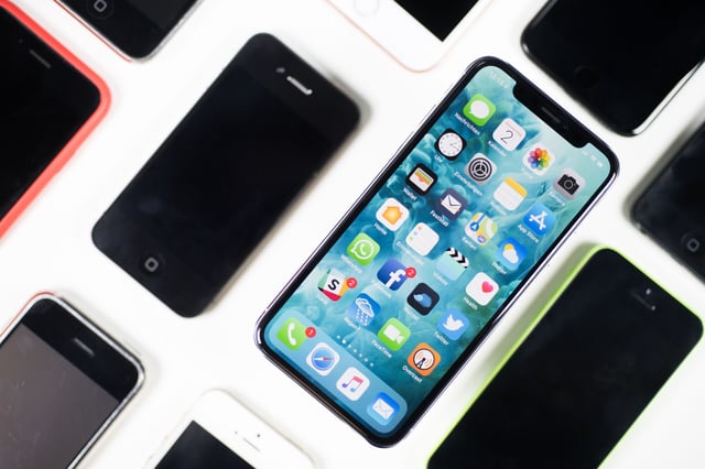 An iPhone X lies on a table next to iPhones of other generations in Berlin, Germany, 2 November 2017. The sale of the iPhone X in Germany starts on 3 November 2017.