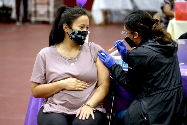 A woman receives a Pfizer vaccination booster shot in Los Angeles, on Nov. 3, 2021.