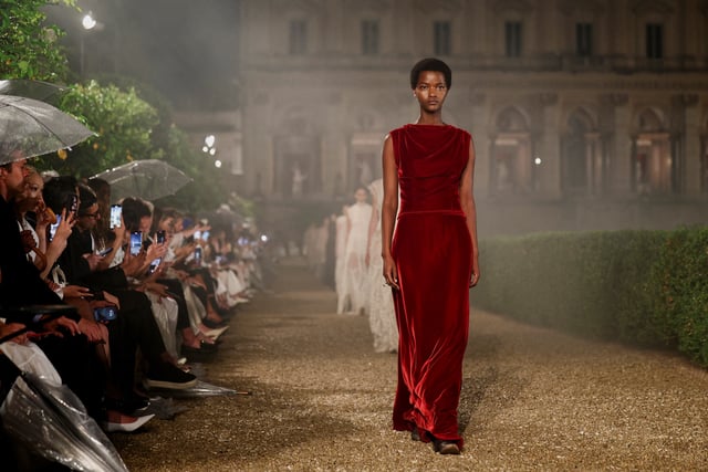 Models present creations by designer Maria Grazia Chiuri during the Christian Dior Cruise 2026 collection show at Villa Albani Torlonia in Rome, Italy, May 27, 2025. REUTERS/Guglielmo Mangiapane