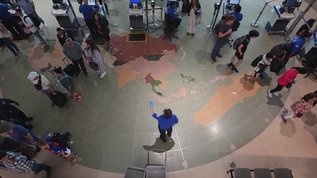 Travellers are directed to lines through security at Love Field airport, Friday, May 23, 2025, in Dallas. (AP Photo/LM Otero)