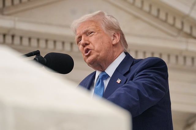 U.S. President Donald Trump delivers remarks at the annual National Memorial Day Observance in the Memorial Amphitheater at Arlington National Cemetery in Arlington, Virginia, U.S., May 26, 2025. REUTERS/Ken Cedeno