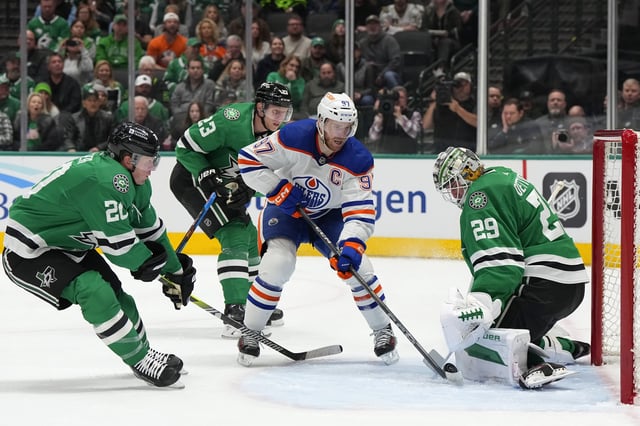 Jake Oettinger #29 of the Dallas Stars stops a shot from Connor McDavid #97 of the Edmonton Oilers during the second period at American Airlines Center on February 17, 2024 in Dallas, Texas.