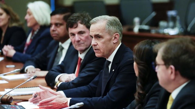 Prime Minister Mark Carney speaks before signing a decision note to eliminate the consumer carbon price on Parliament Hill in Ottawa on Friday, March 14, 2025. THE CANADIAN PRESS/Justin Tang