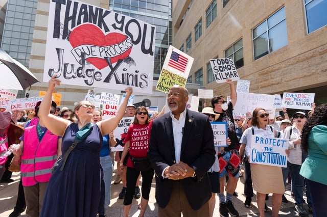 Rep. Glenn Ivey, D-Md., center, joins a rally outside the U.S. Courthouse in Greenbelt, Md., where a federal judge will hear arguments Friday, May 16, 2025. (AP Photo/Manuel Balce Ceneta)
