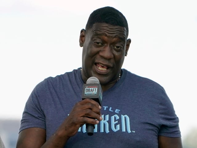 Former NBA basketball player Shawn Kemp speaks during the Seattle Kraken's NHL hockey expansion draft event in Seattle, July 21, 2021. Prosecutors in Washington state charged former NBA star Shawn Kemp on Friday, April 14, 2023, with first-degree assault in a parking lot shooting last month over a stolen cell phone, noting that in a text message just before the shooting, Kemp wrote, "I'm about to shoot this (expletive)." (Ted S. Warren, File/AP)