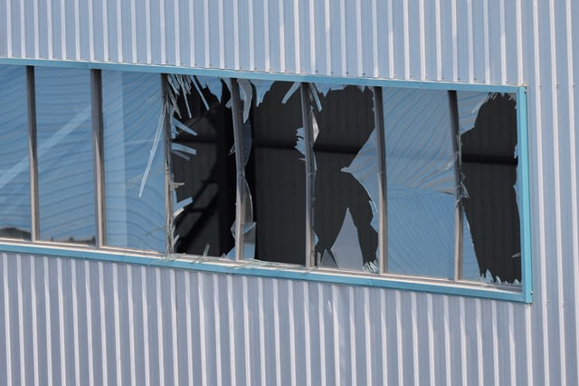 Damaged windows are seen near the site of the chemical plant explosion in Gaomi, Shandong province, China May 28, 2025. REUTERS/Go Nakamura