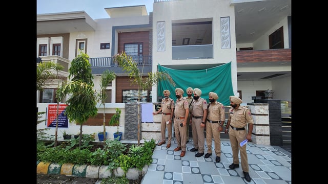 Police party at the property of dismissed constable Amandeep Kaur in Bathinda on Monday. (Sanjeev Kumar/HT)