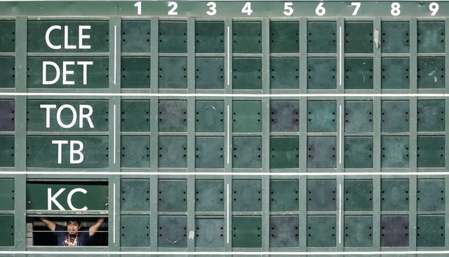 A scoreboard operator watches the Astros take batting practice before an MLB baseball game in Houston, Tuesday, May 27, 2025.