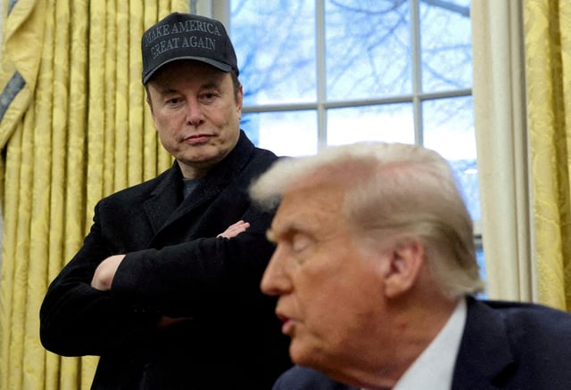FILE PHOTO: Elon Musk listens to U.S. President Donald Trump speak in the Oval Office of the White House in Washington, D.C., U.S., February 11, 2025. REUTERS/Kevin Lamarque/File Photo/File Photo