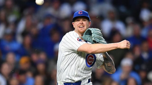 May 27, 2025; Chicago, Illinois, USA; Chicago Cubs starting pitcher Cade Horton (22) throws to first base during the fourth inning against the Colorado Rockies at Wrigley Field. Mandatory Credit: Patrick Gorski-Imagn Images