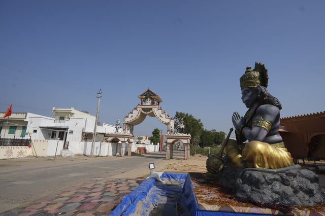 FILE - A statue of Monkey God Hanuman, installed as part of a religious celebrations, is seen in front of an entrance gate of Dingucha village in Gandhinagar, India, Tuesday, Nov. 12, 2024. (AP Photo/Ajit Solanki, File)