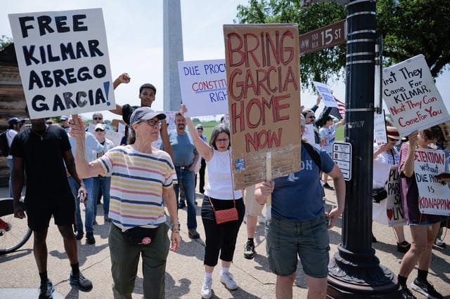 Protesters can be seen marching along 15th Street Northwest on their way to the White House to demand the return of Kilmar Armando Abrego Garcia to the United States and to mark the May Day holiday on May 01, 2025, in Washington, D.C. (Photo by Chip Somodevilla/Getty Images)