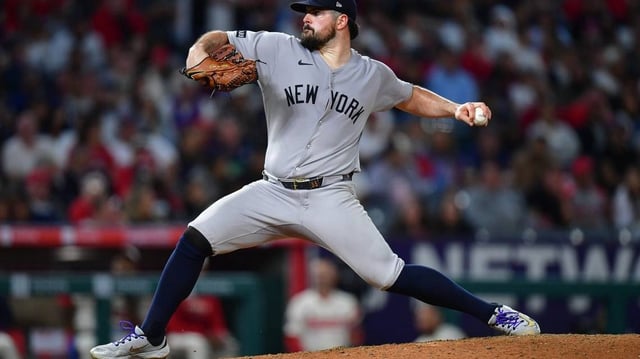 May 27, 2025; Anaheim, California, USA; New York Yankees pitcher Carlos Rodon (55) throws against the Los Angeles Angels during the seventh inning at Angel Stadium. Mandatory Credit: Gary A. Vasquez-Imagn Images