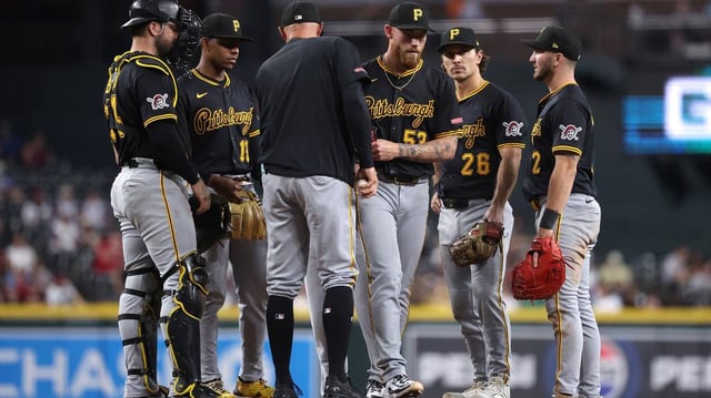 Pittsburgh Pirates manager Don Kelly, middle, takes the ball from starting pitcher Mike Burrows (53) for a pitching change during the fourth inning against the Arizona Diamondbacks at Chase Field on Tuesday, May 27, 2025, in Phoenix. (Chris Coduto/Getty Images/TNS)