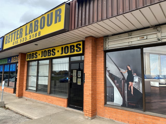 A view of an illustration outside a wood flooring sales office next to an employment agency in Toronto, Ontario, Canada October 8, 2021. REUTERS/Chris Helgren/File Photo