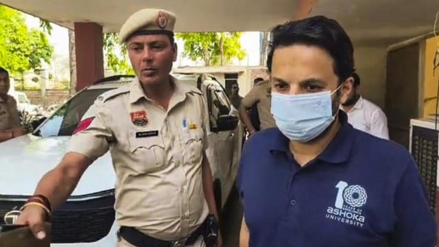 Sonipat: Ashoka University professor Ali Khan Mahmudabad being escorted by police personnel after his arrest in Sonipat on May 18. (PTI)