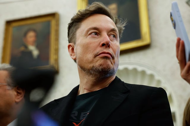 Elon Musk listens as reporters ask US President Donald Trump and South Africa President Cyril Ramaphosa questions during a press availability in the Oval Office at the White House on May 21, 2025, in Washington, DC.