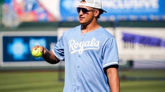 Kansas City Chiefs quarterback Patrick Mahomes wearing a Kansas City Royals jersey.