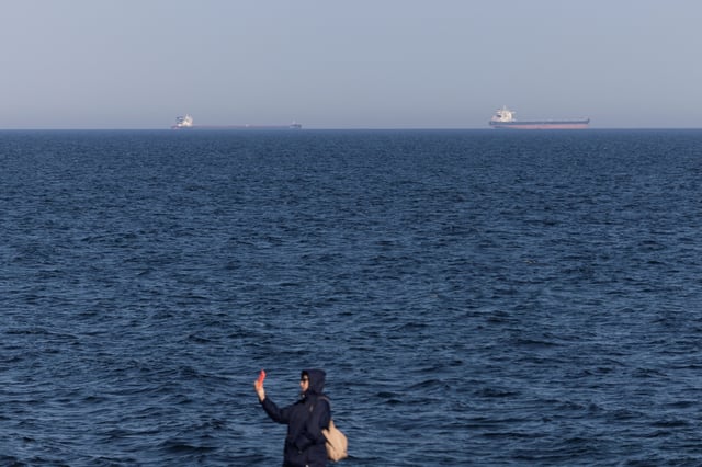Cargo vessels are seen in the Black Sea, amid Russia's attack on Ukraine, near Odesa, Ukraine March 22, 2025. REUTERS/Valentyn Ogirenko/File Photo