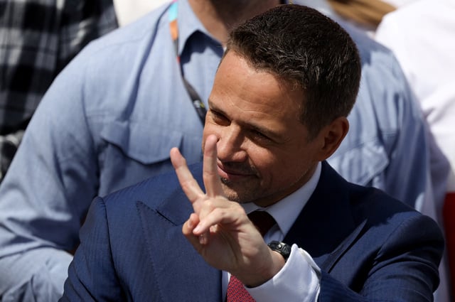 Warsaw Mayor Rafal Trzaskowski, the presidential candidate of the Civic Coalition, attends the "Patriotic March" organised by the ruling party, ahead of the second round of presidential elections, in Warsaw, Poland, May 25, 2025. REUTERS/Kacper Pempel/File Photo