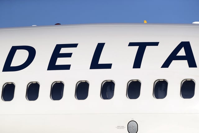 The company logo along the side of a Delta Air Lines jetliner at Denver International Airport in Denver, on June 26, 2019. This plane was not involved in the sick dog incident.