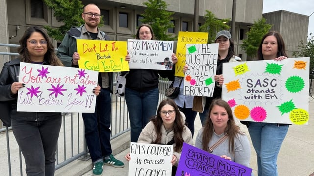 Demonstrators from the Sexual Assault Support Centre of Waterloo were outside the courthouse today, holding signs in support of E.M., the complainant.