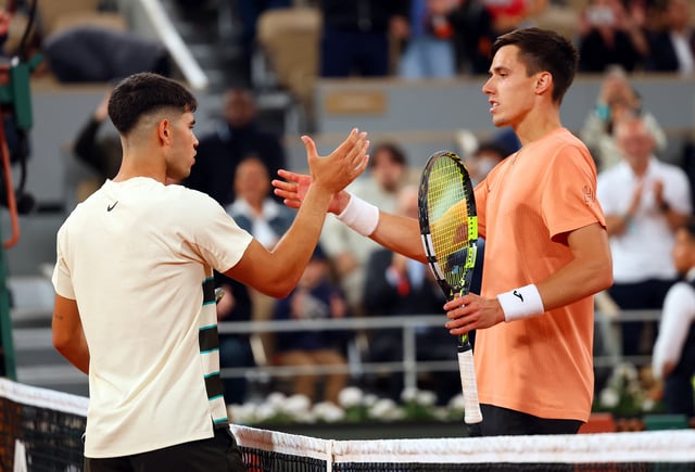 Tennis - French Open - Roland Garros, Paris, France - May 28, 2025 Spain's Carlos Alcaraz shakes hands with Hungary's Fabian Marozsan after winning his second round match REUTERS/Denis Balibouse