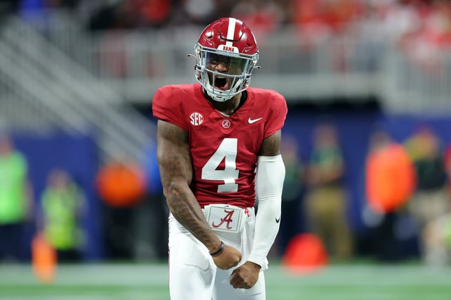 Jalen Milroe #4 of the Alabama Crimson Tide celebrates after passing for a touchdown during the second quarter against the Georgia Bulldogs in the SEC Championship at Mercedes-Benz Stadium on December 02, 2023 in Atlanta, Georgia.